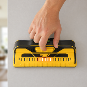 Stud finder wall scanner used against drywall
